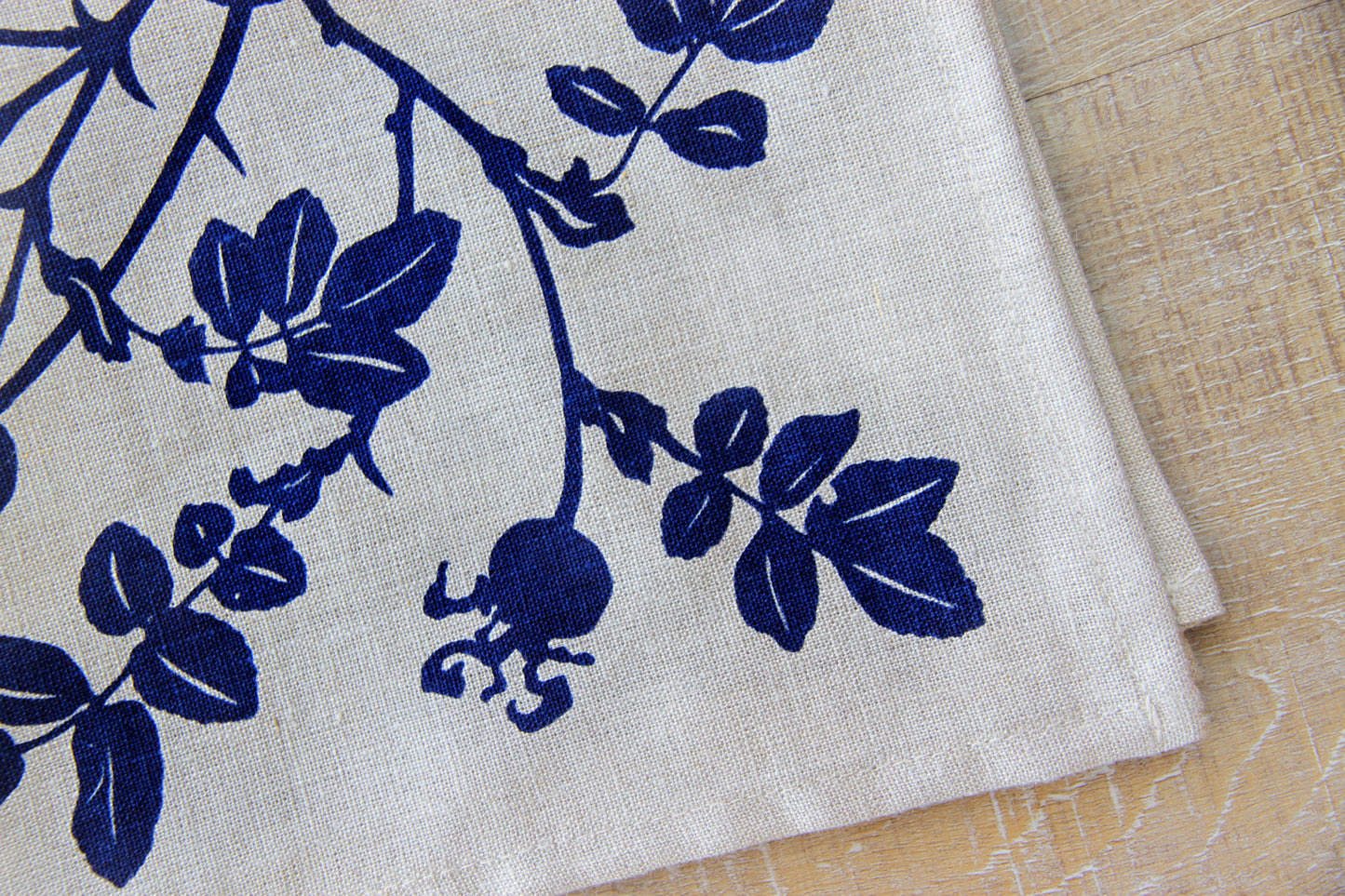 Nootka Rose Hip Napkin in Blackberry on Natural Flax Linen