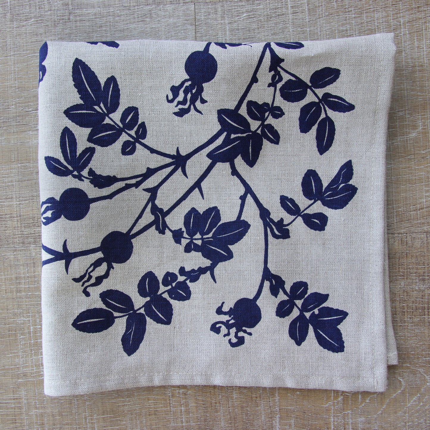 Nootka Rose Hip Napkin in Blackberry on Natural Flax Linen