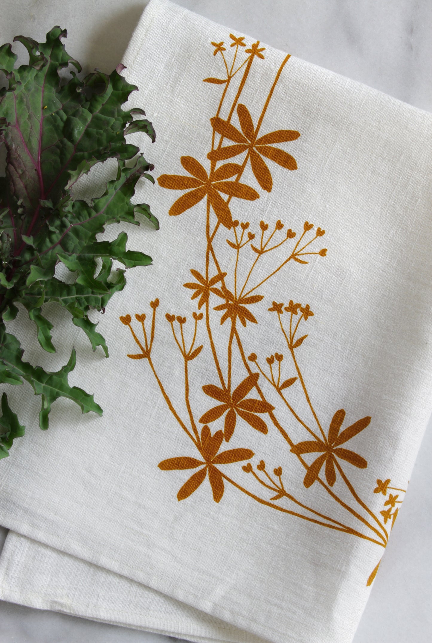 Bedstraw Kitchen Towel in Ochre on White Linen