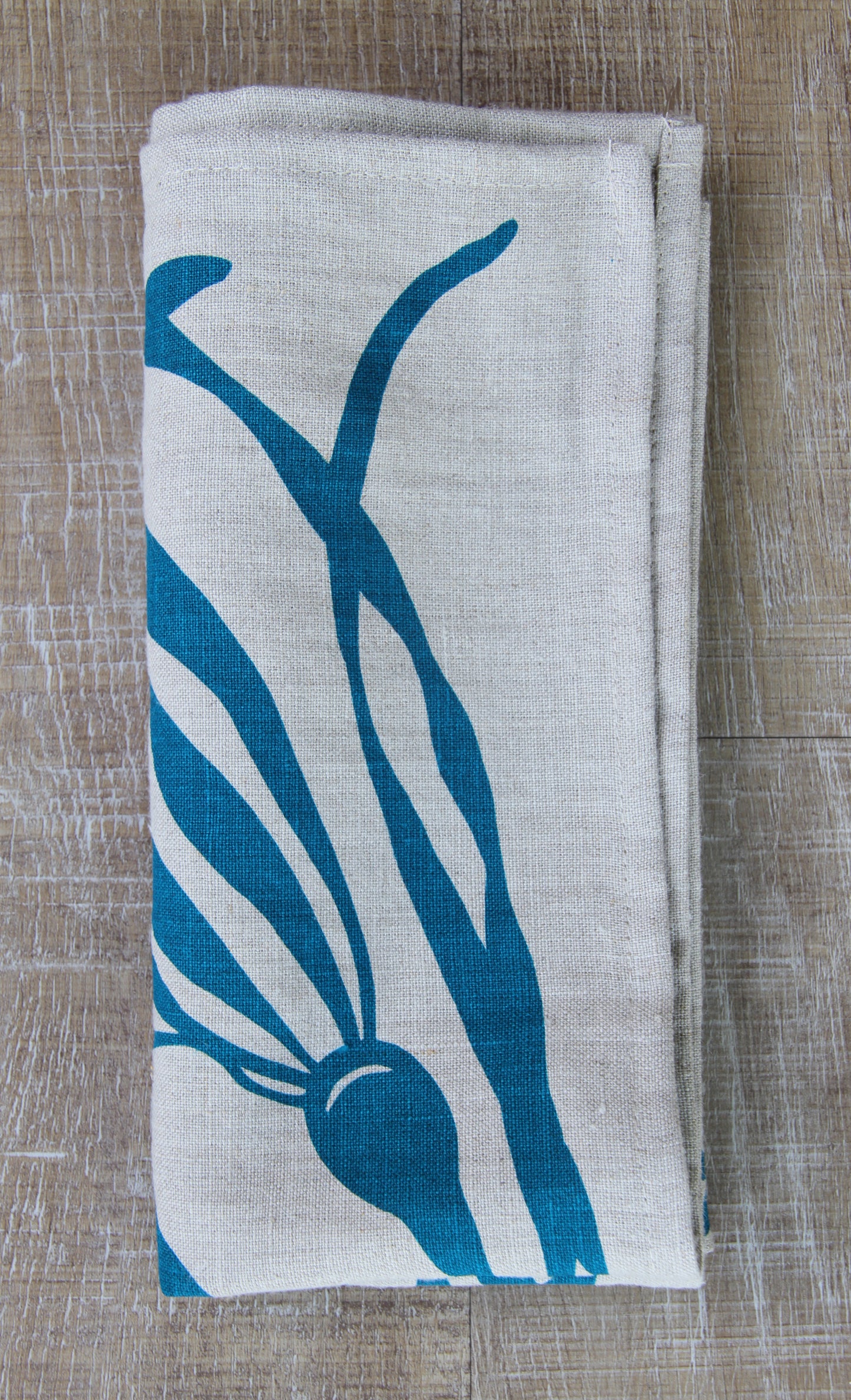 Bull Kelp Napkin in Pool on Natural Flax Linen