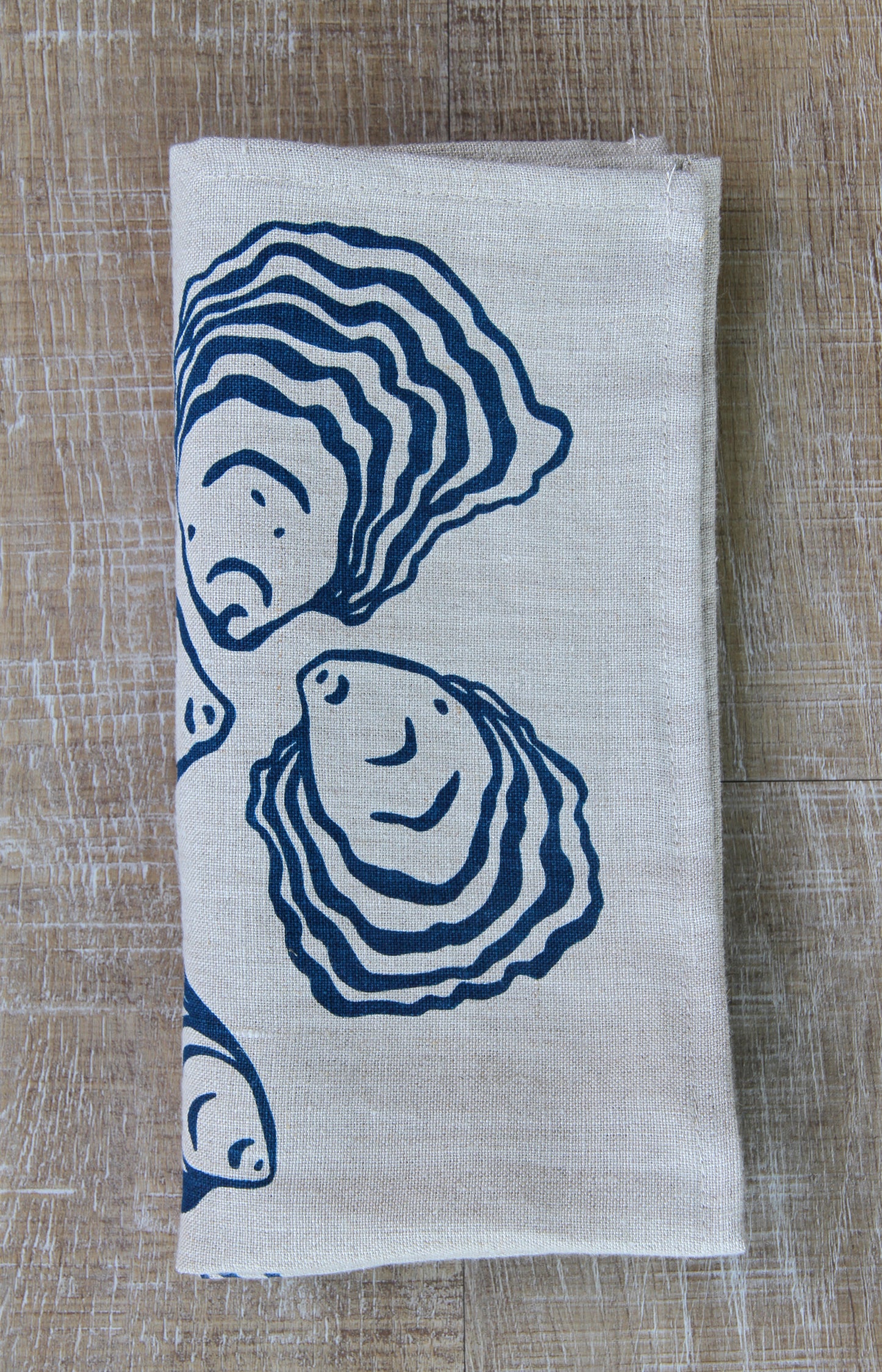 Oyster Napkin in Deep Marine on Natural Linen