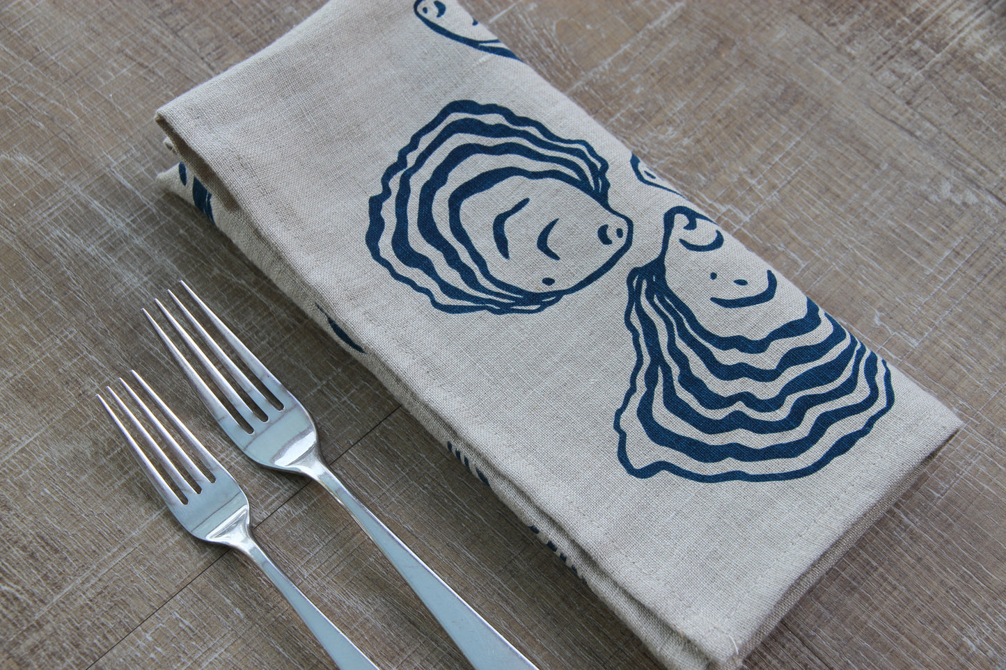 Oyster Napkin in Deep Marine on Natural Linen