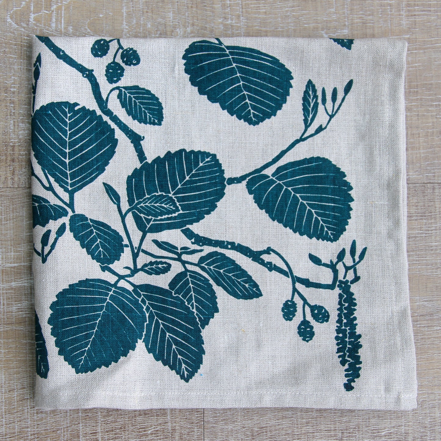 Alder Napkin in Peacock on Natural Linen