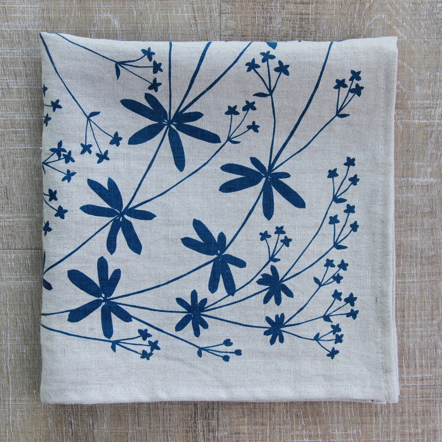 Bedstraw Napkin in Deep Marine on Natural Linen