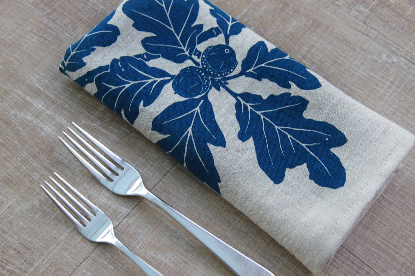 Garry Oak Napkin in Deep Marine on Natural Linen
