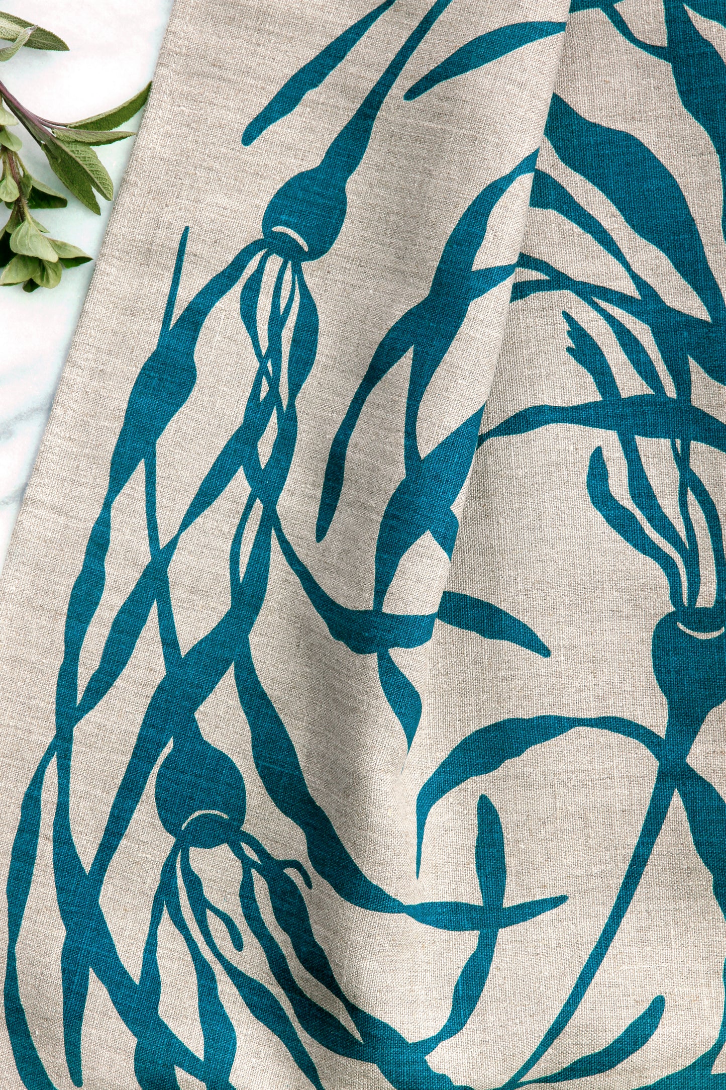 Kelp Swirly Kitchen Towel in Pool on Natural Linen