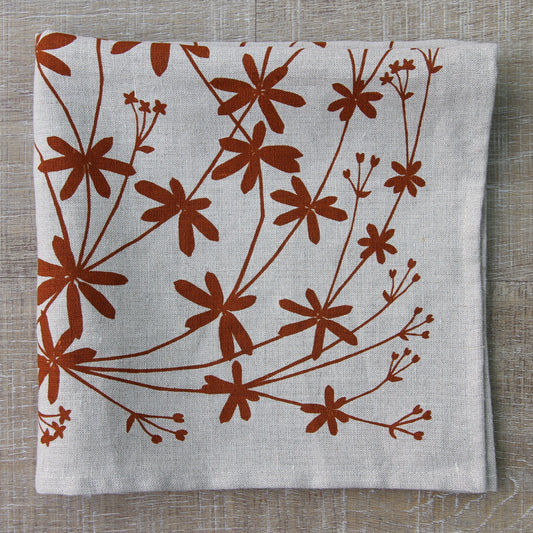 Bedstraw Napkin in Rust on Natural Linen